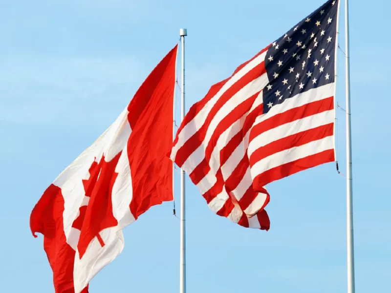 Large Canada and USA flags flying on cone tapered aluminium flagpoles | The Flag Shop Large Canada and USA flags flying on cone tapered aluminium flagpoles